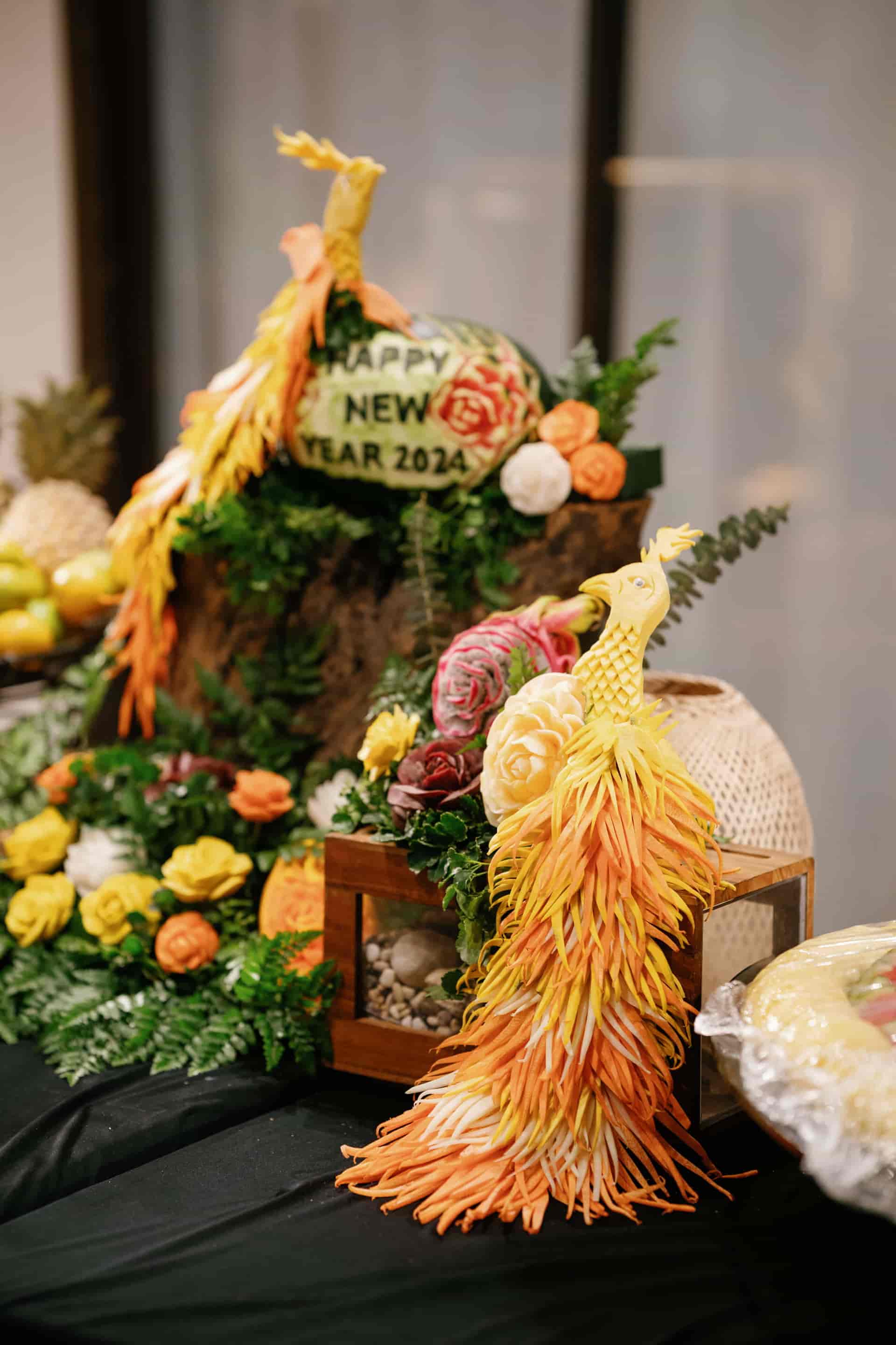 Parties And Events17 A beautifully arranged table featuring an assortment of fruit and vibrant flowers, perfect for event venues in Phuket.